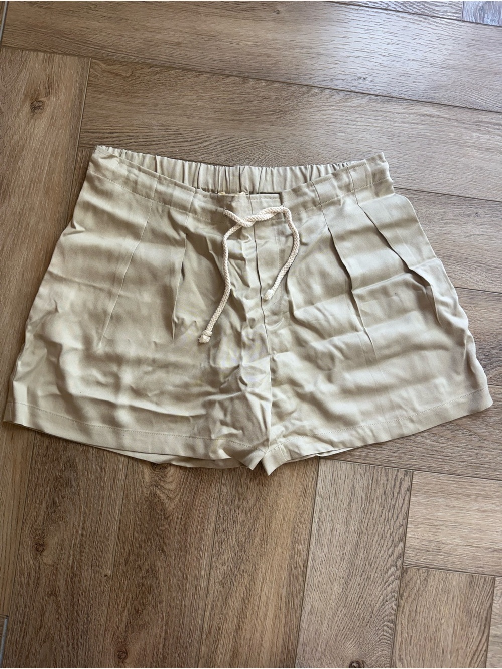 DONNI. High-Waist Drawstring Shorts in Light Tan